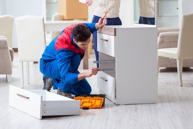 Home 3 Handyman fitting a drawer unit
